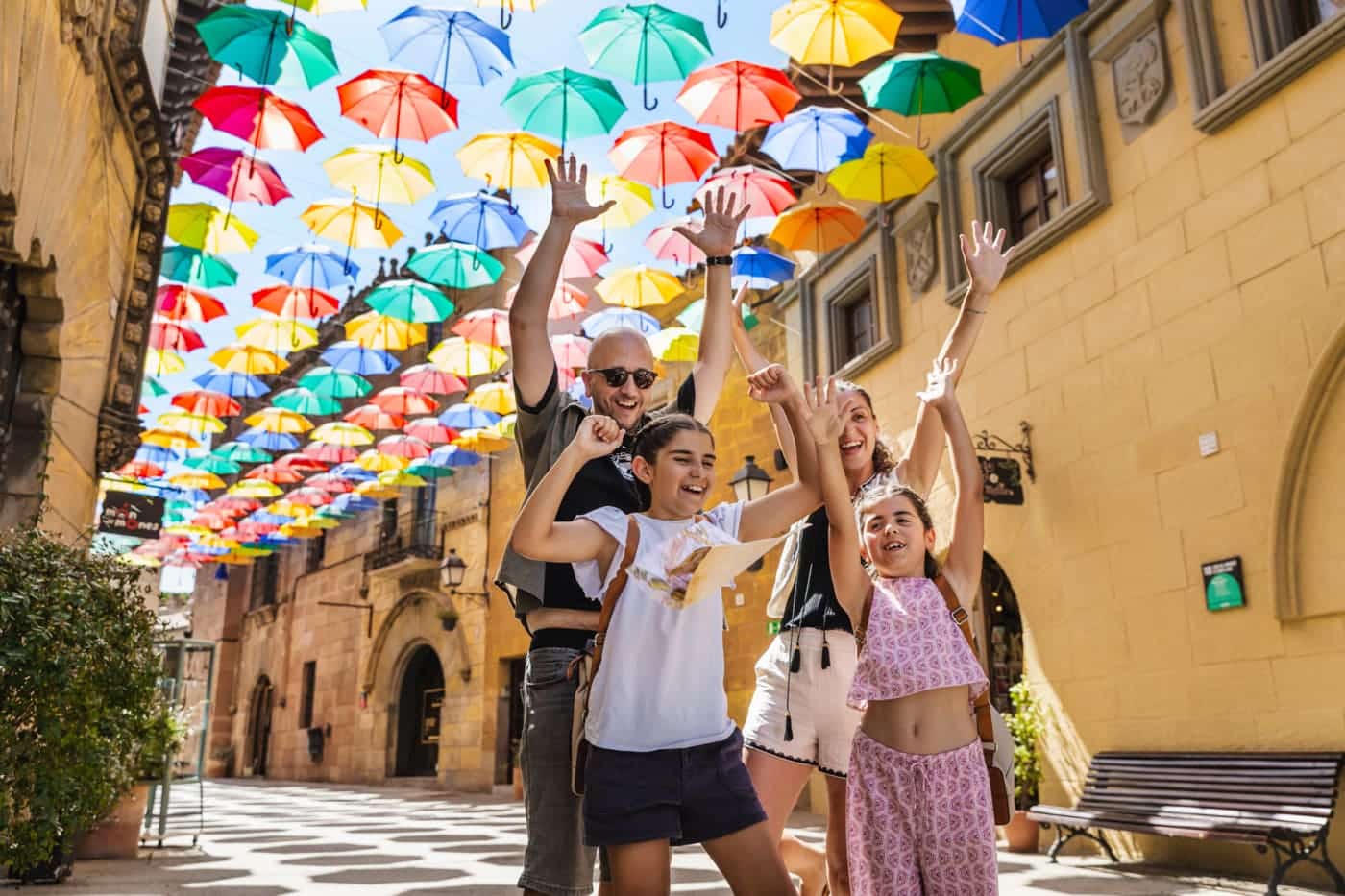 Poble Espanyol family umbrellas street